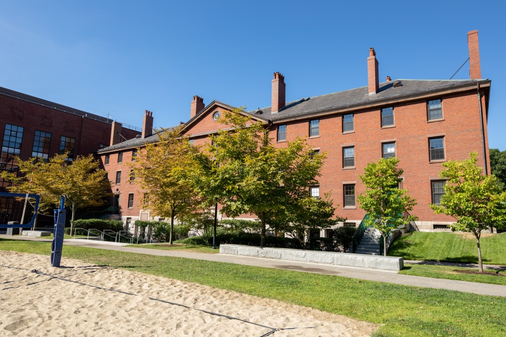 Divinity Hall, with the sand volleyball court in the foreground.